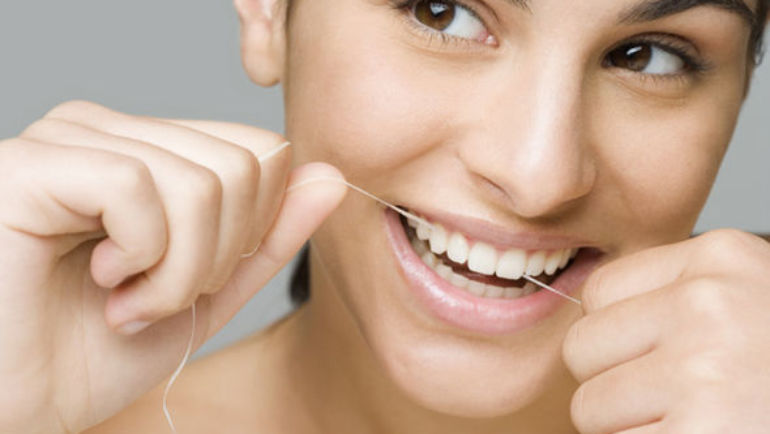How to use dental floss properly